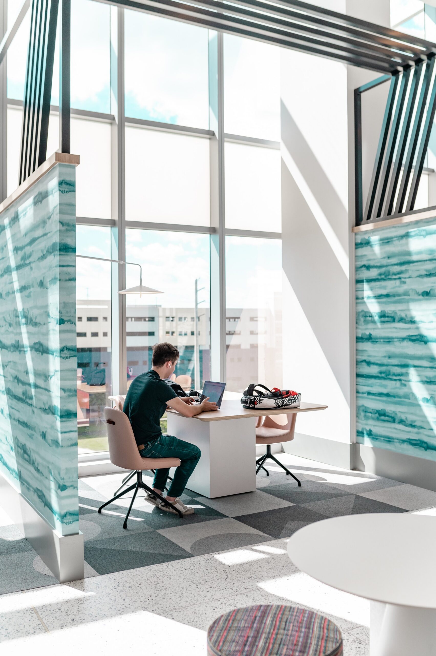 apartment coworking lounge study desk large windows scaled
