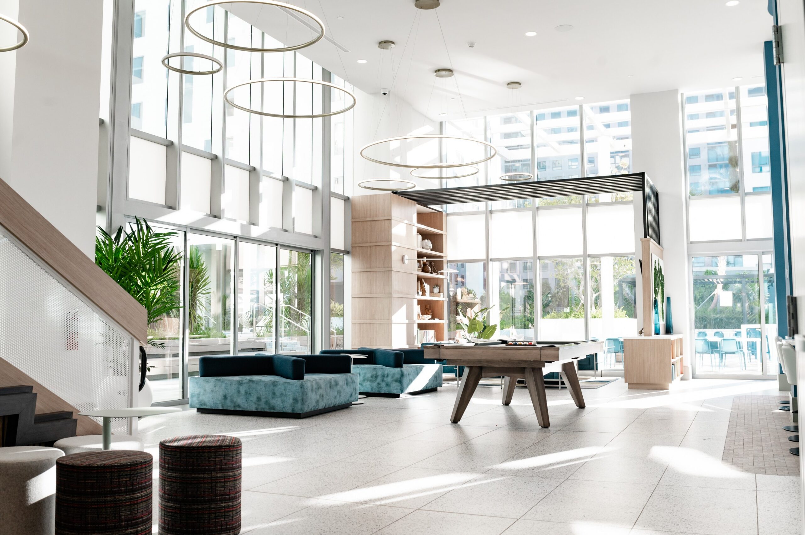 apartment lobby billiards table ring chandeliers scaled