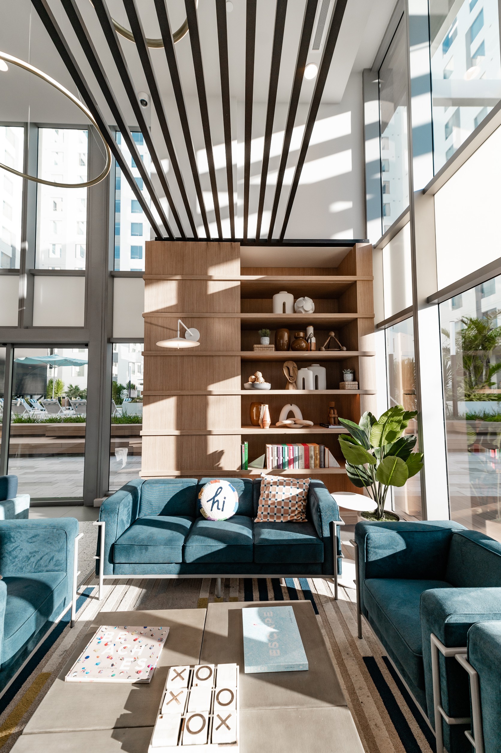 apartment resident lounge velvet seating shelving